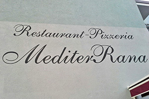 Restaurantname auf Wand gemalt